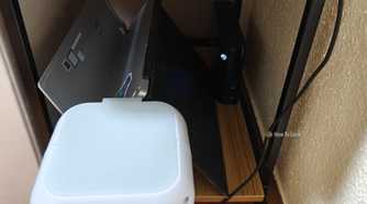 An evaporative USB cooler next to a home server.