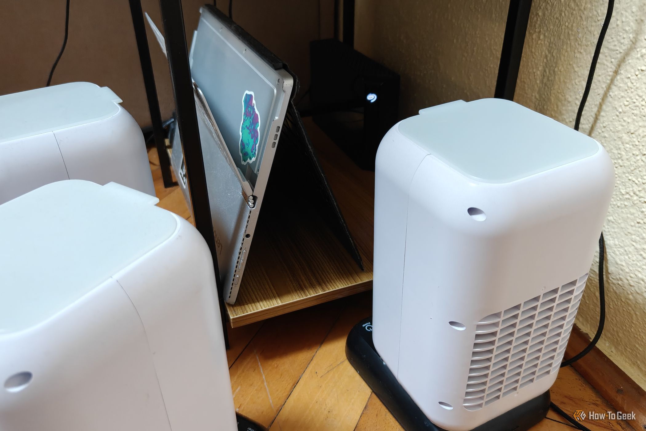A few evaporative USB coolers next to a home server.