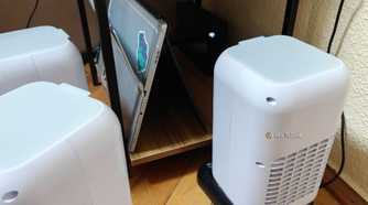 A few evaporative USB coolers next to a home server.