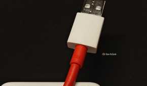 A close-up of a 12A USB-A fast-charging OnePlus cable.