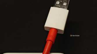 A close-up of a 12A USB-A fast-charging OnePlus cable.