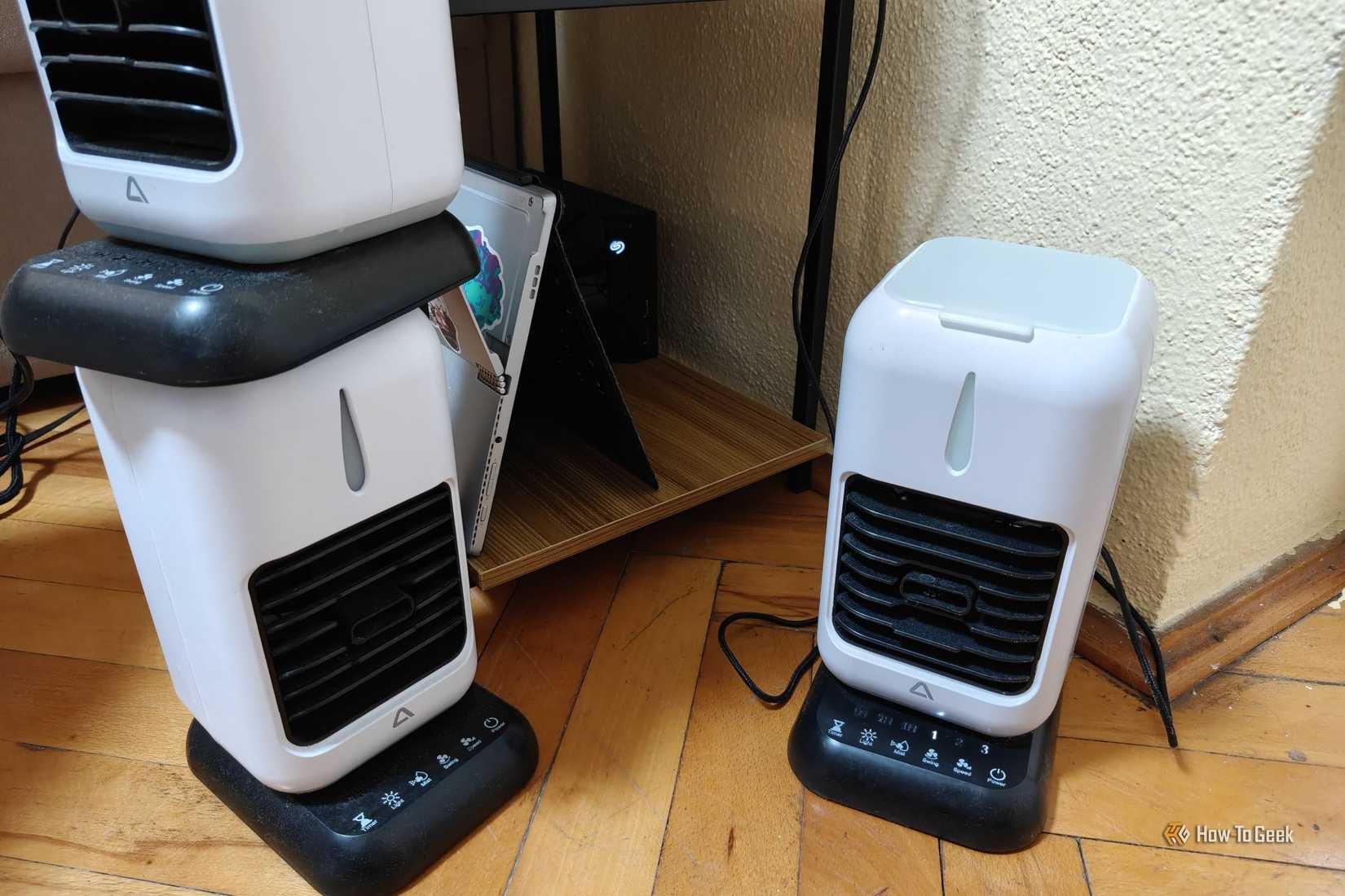 A few evaporative fans next to a home server.
