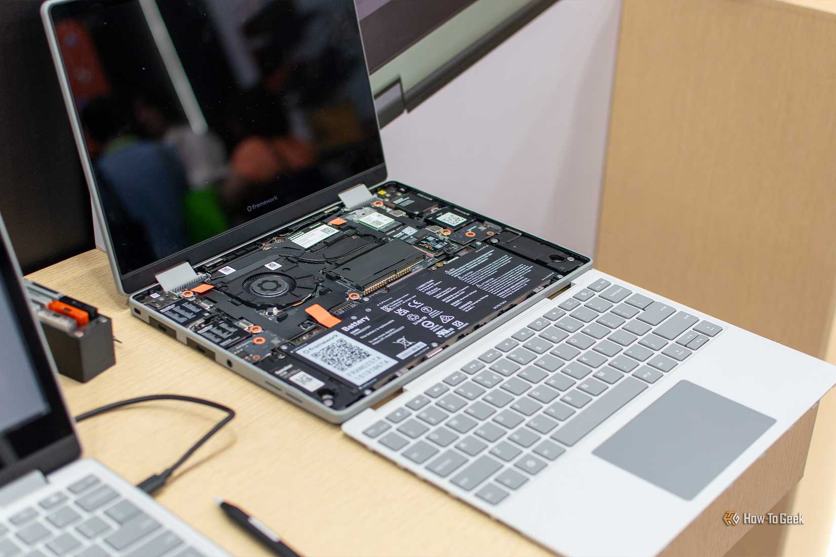 Framework laptop with its keyboard removed and internal components exposed at Computex 2026.
