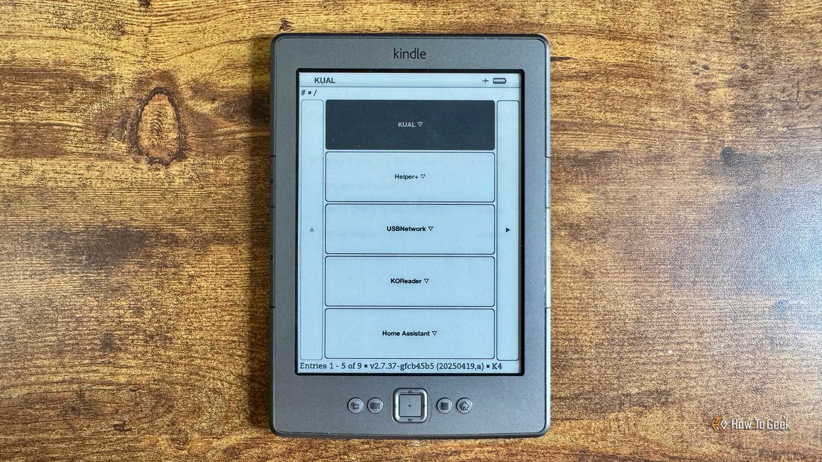 Kindle KUAL launcher menu listing KUAL Helper+ USBNetwork KOReader and Home Assistant apps.