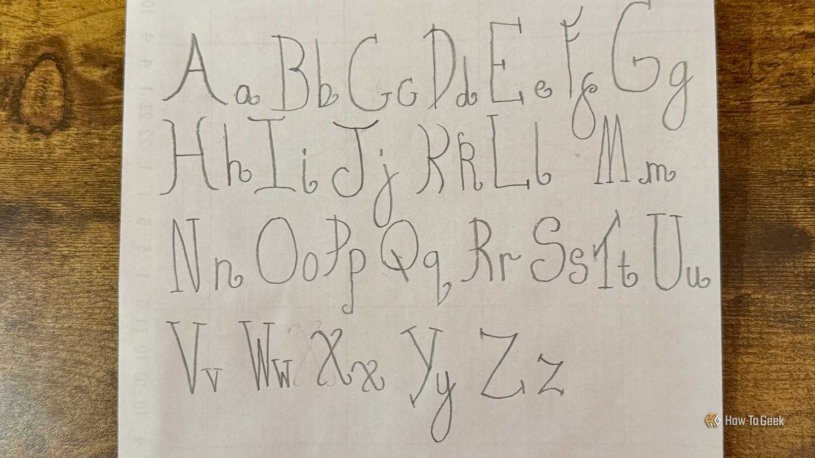 我女儿在方格纸上整齐书写的铅笔字母表，包含大小写字母 A 到 Z，用于 Draw Your Font 技能。