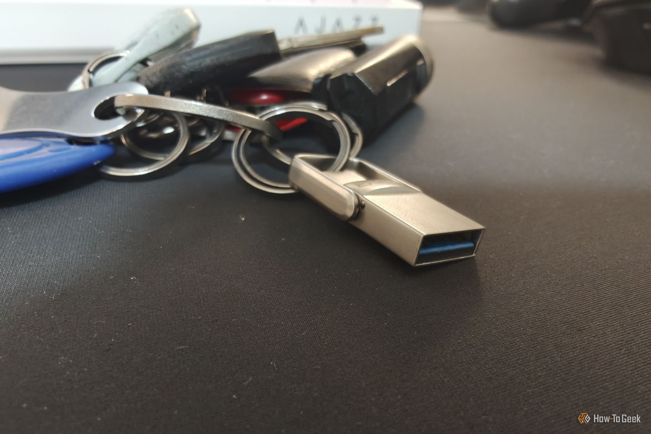 A tiny USB drive attached to a keychain.