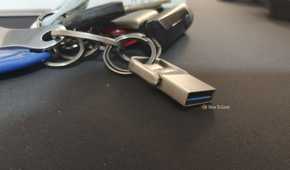 A tiny USB drive attached to a keychain.
