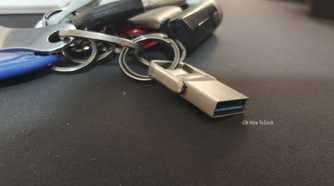 A tiny USB drive attached to a keychain.