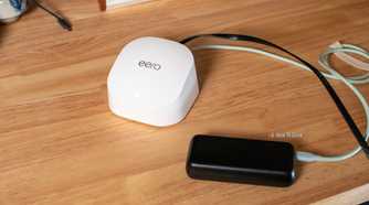 Top-down view of Eero Wi-Fi router and power bank.