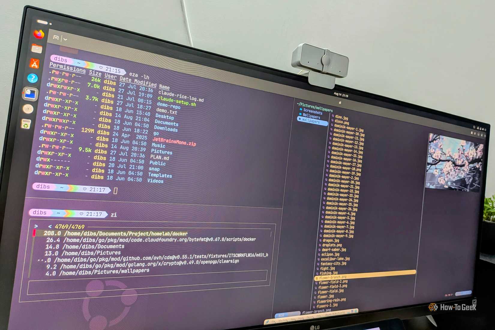 Yazi terminal file manager showing a three-column layout with wallpaper thumbnails and an image preview pane.