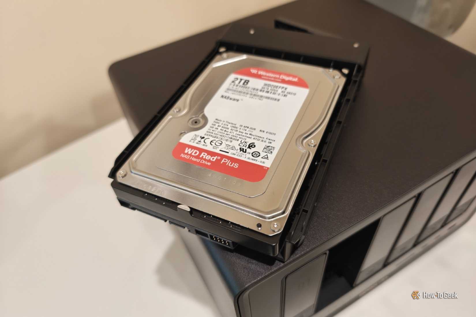 Hard drive on top of a UGREEN DXP6800 Ultra.