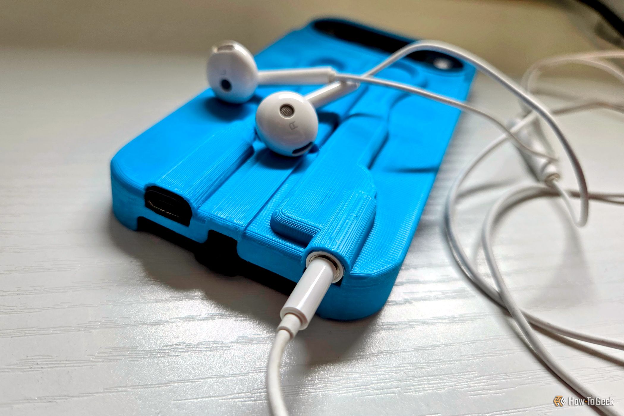 My phone doesn't have a headphone jack, so I made a case to bring it back