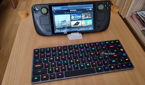 A Steam Deck with a low-profile keyboard in front of it.