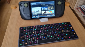 A Steam Deck with a low-profile keyboard in front of it.