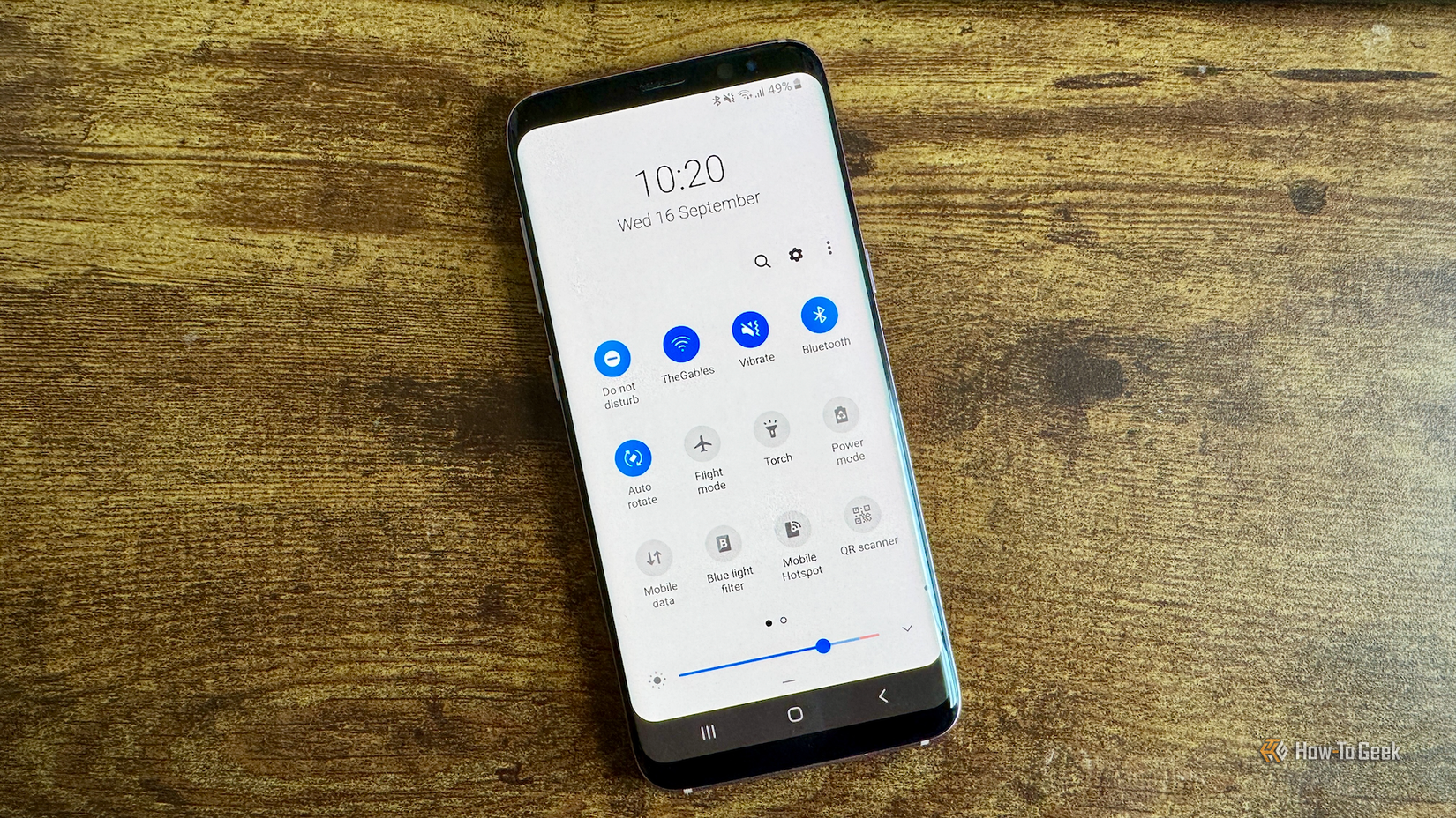 An Android phone showing the Quick settings screen with the Do Not Disturb tile activated and in the first position on the list.