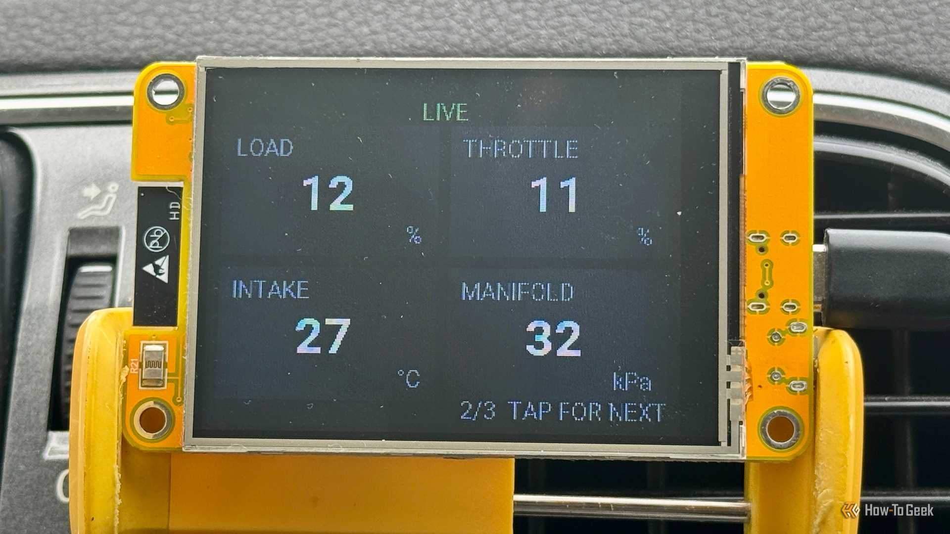 Cheap Yellow Display Mounted On A Car Air Vent Showing The Live Screen…