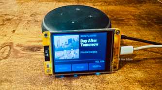 Cheap Yellow Display mounted on an Echo speaker showing a Now Playing screen for Day After Tomorrow by Phoebe Bridgers.