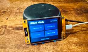 Cheap Yellow Display mounted on an Echo speaker showing Home Assistant smart home controls for Dining Lights Main Lights Heating and Dinner Scene.