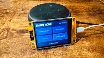 Cheap Yellow Display mounted on an Echo speaker showing Home Assistant smart home controls for Dining Lights Main Lights Heating and Dinner Scene.