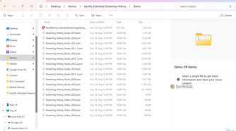 File Explorer showing the unzipped Spotify export with Streaming_History_Audio JSON files from 2019 to 2026.