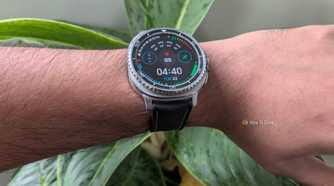 Galaxy Watch 8 Classic worn on the wrist showing a data-heavy watch face with 69 bpm heart rate and a 78 percent battery indicator.