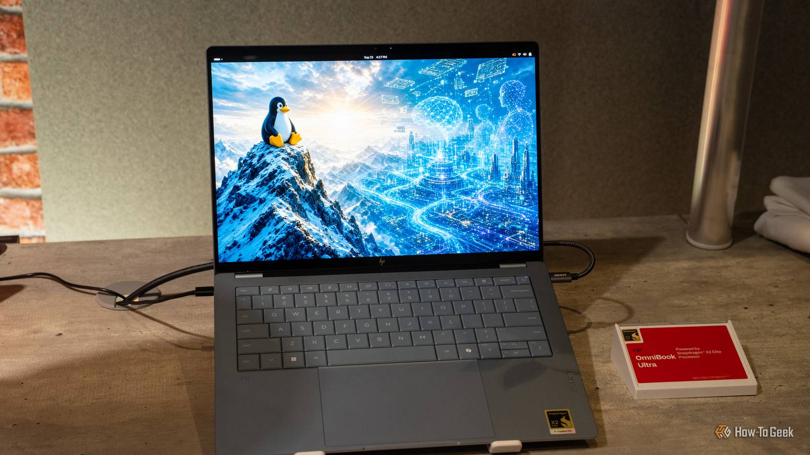 HP OmniBook Ultra front view with Linux penguin wallpaper in view.