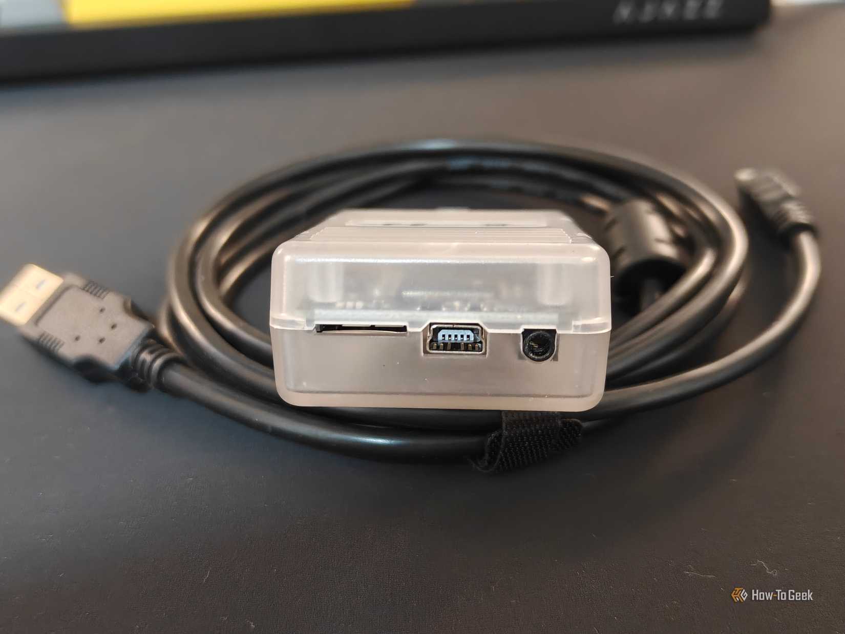 USB and diagnostic connections on a Tactrix OpenPort 2.0 OBD-II interface.