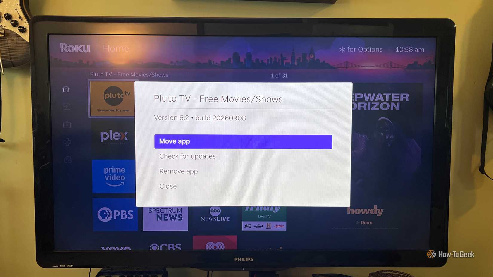 The Roku options menu for Pluto TV shows Move app highlighted for rearranging its position on the Home screen.