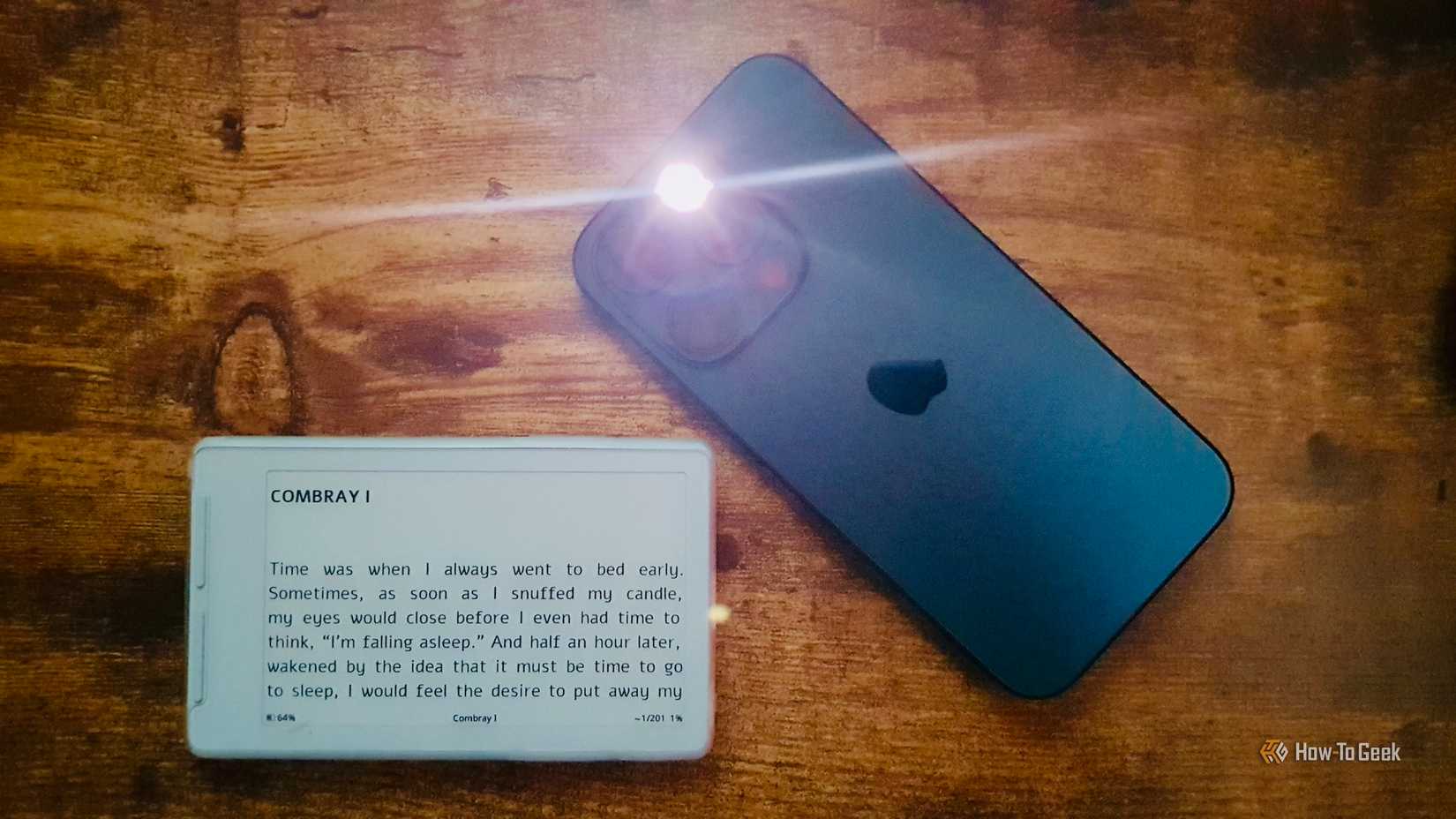 iPhone flashlight turned on next to the Xteink X4 Classic eReader displaying the Combray I opening page.