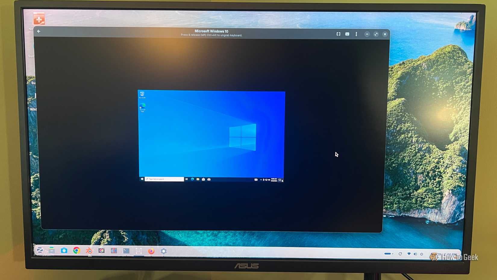 Windows 10 runs in a GNOME Boxes window on the Zorin OS desktop of an older Dell PC.