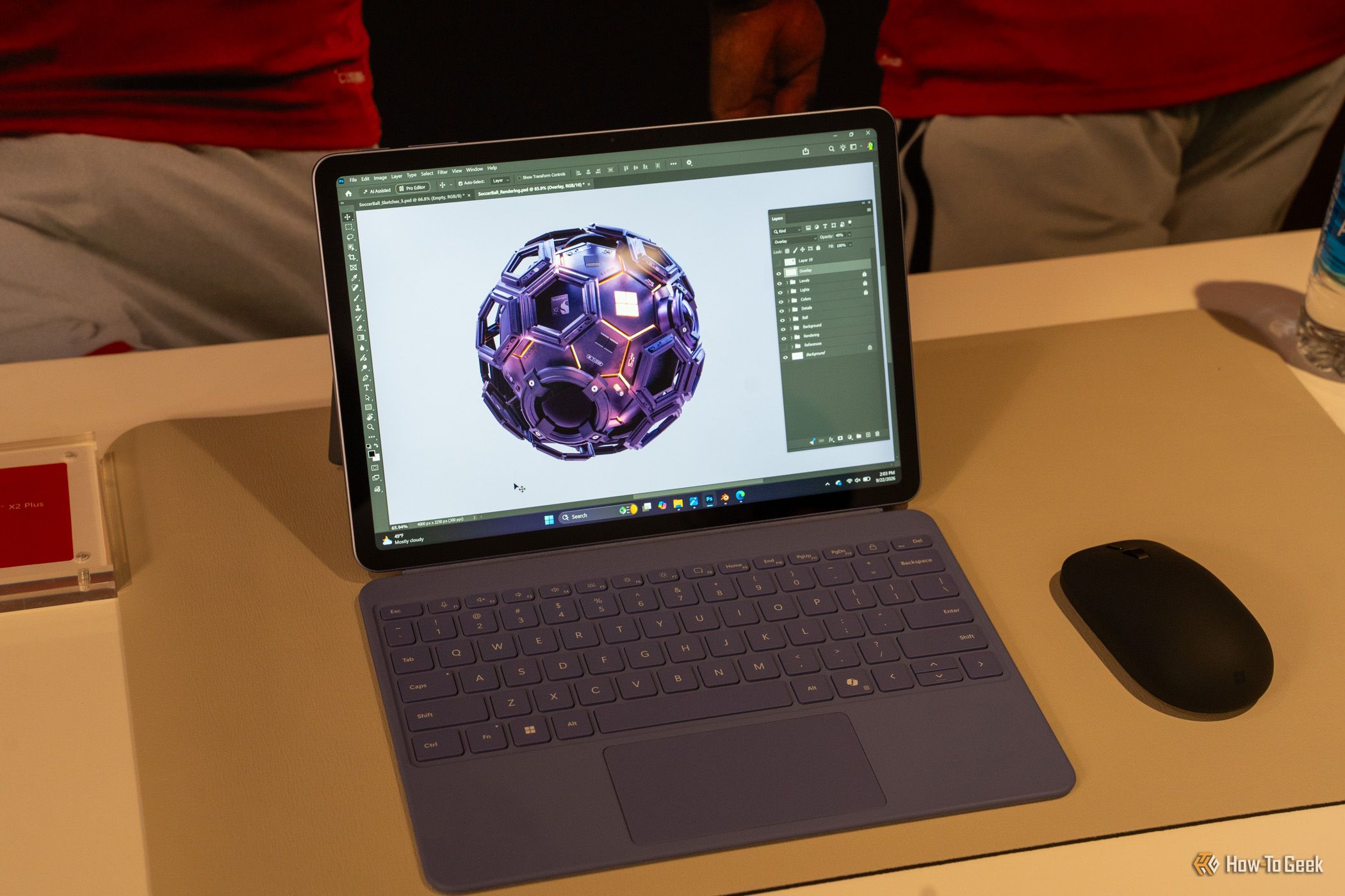 Microsoft Surface Pro 12-inch 2nd Edition with purple keyboard showing Photoshop artwork.
