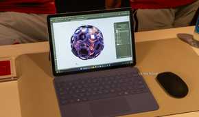 Microsoft Surface Pro 12-inch 2nd Edition with purple keyboard showing Photoshop artwork.