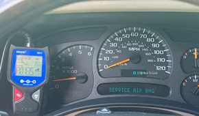 An Innova 3011 OBD-II scanner connected beside the dashboard cluster.