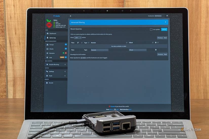 A Raspberry Pi sitting on a laptop. 