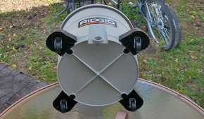 Photo showing the bottom of a Ridgid wet/dry vac, displaying the wheels for easier portability when blowing or sucking up debris