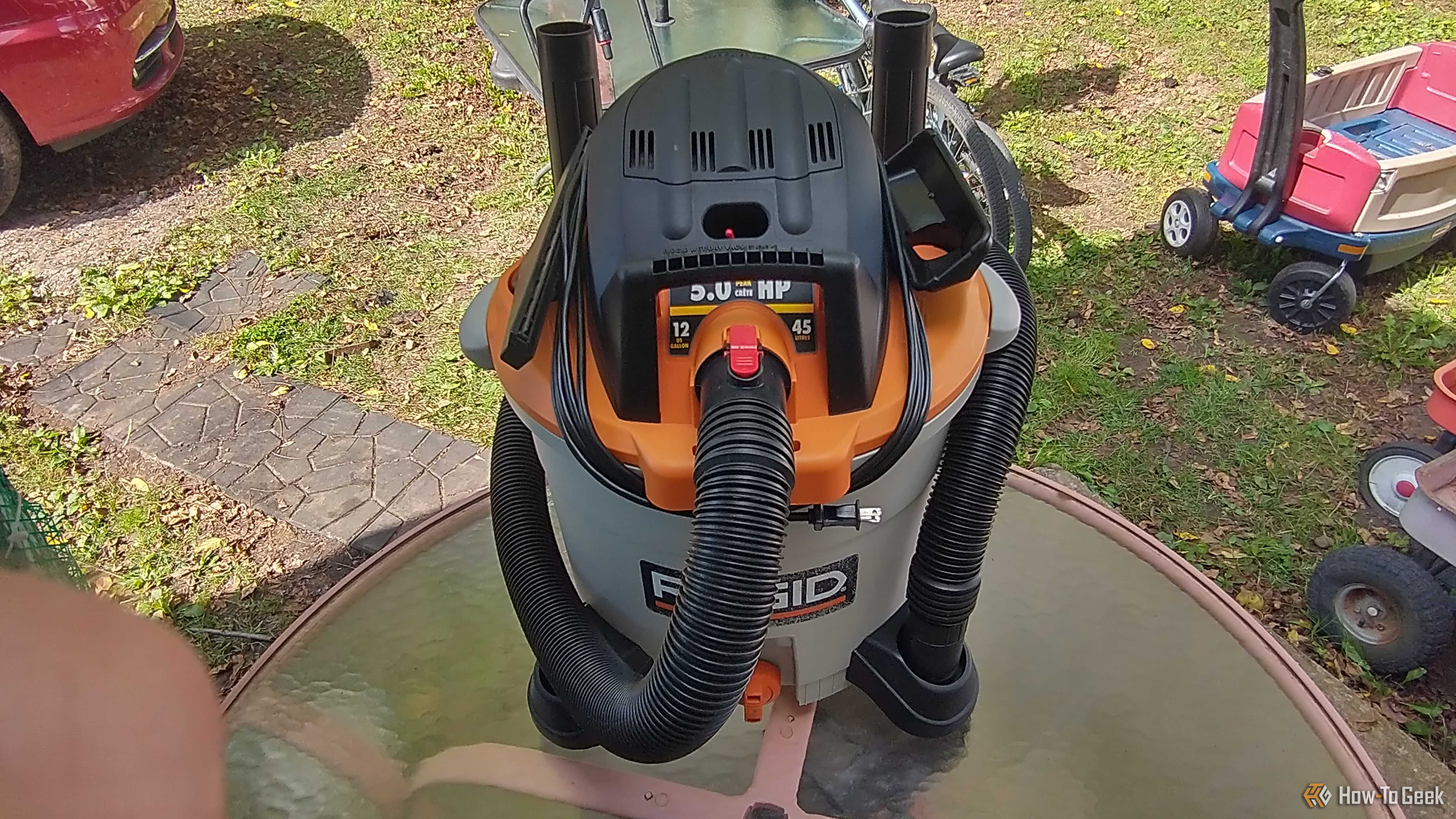 Photo of a Ridgid wet/dry vac on a table with accessories mounted