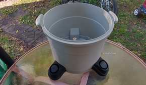 Photo of a Ridgid wet/dry vac tub sitting on an outdoor table