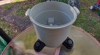 Photo of a Ridgid wet/dry vac tub sitting on an outdoor table
