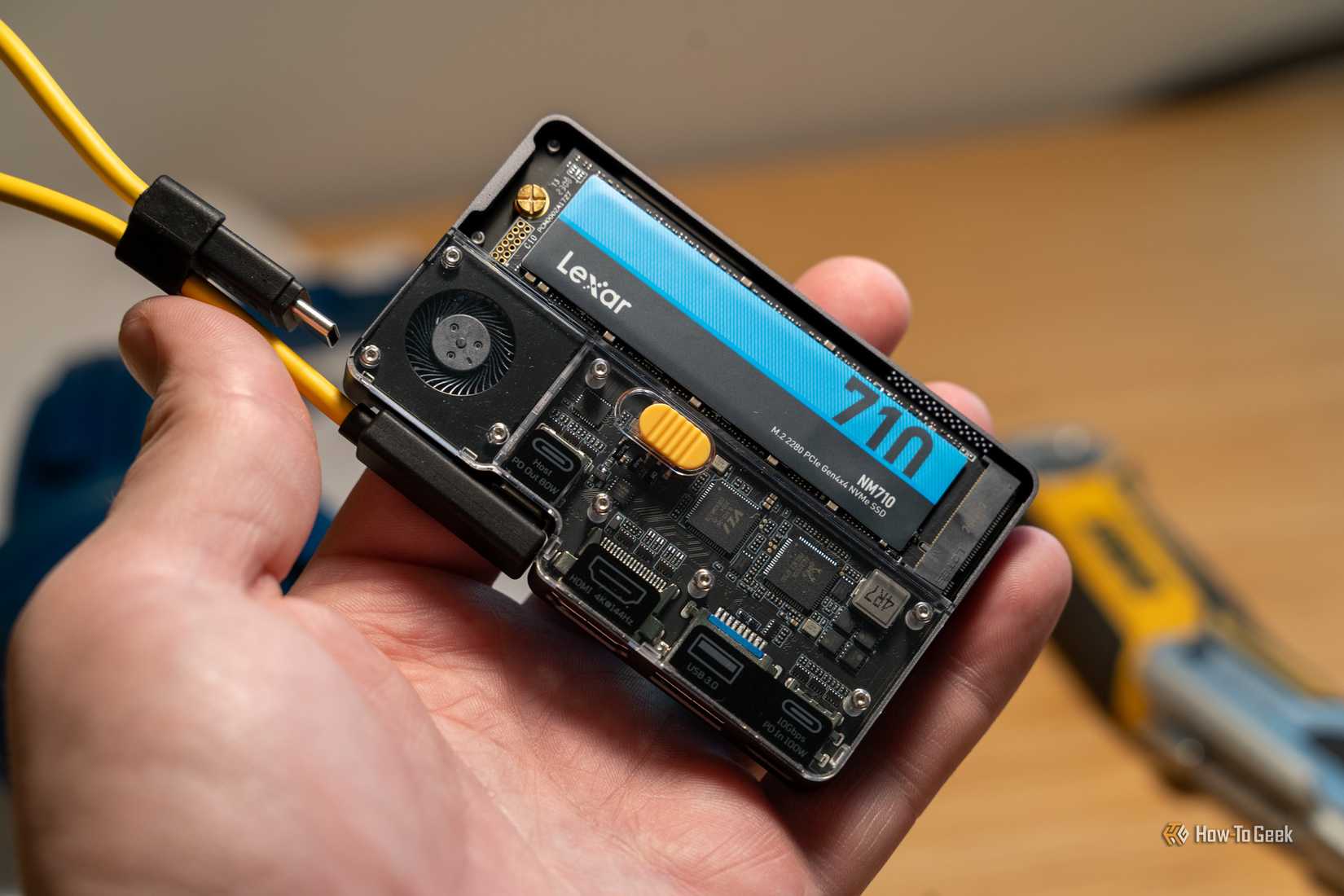 SHARGE Disk Pro 2 with Lexar NM710 SSD held in hand.