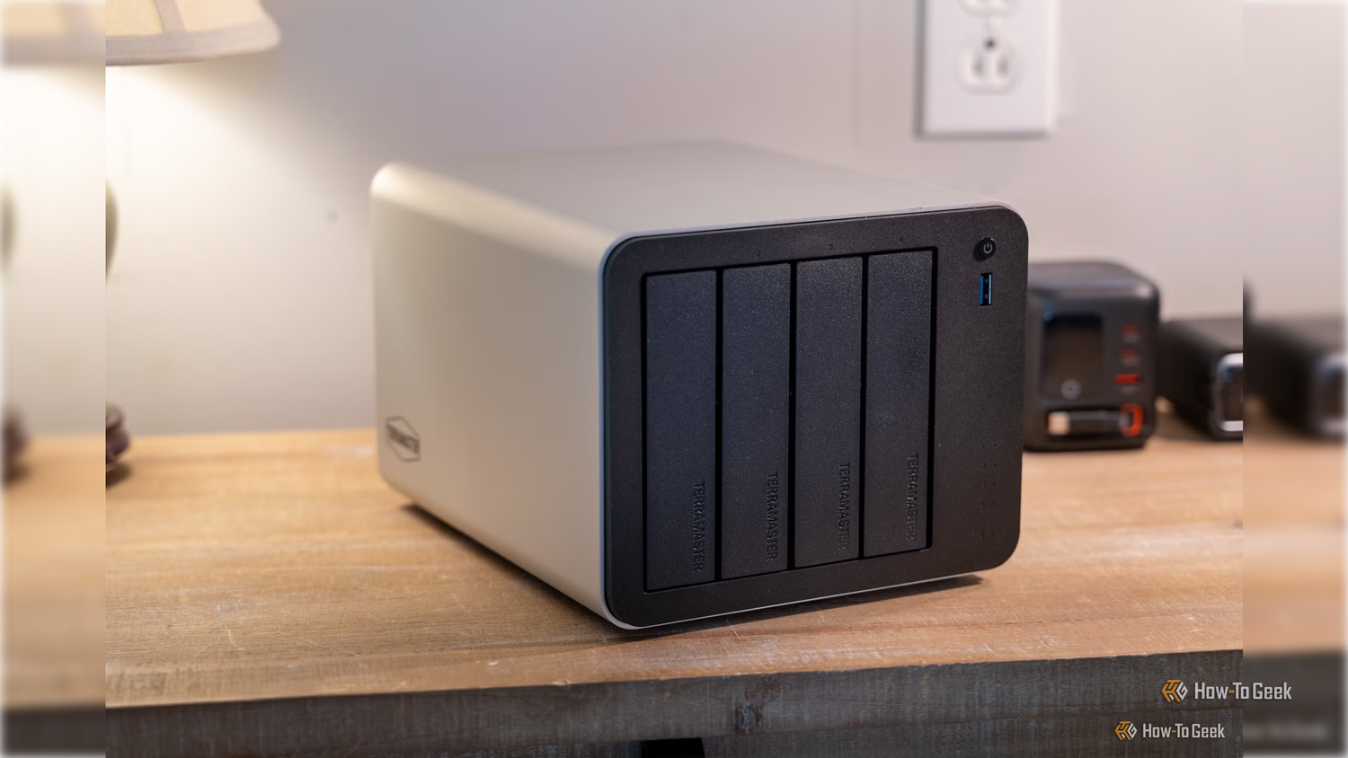 terramaster-f4-425-pro nas front four bay chassis with usb port and power button sitting on a table.