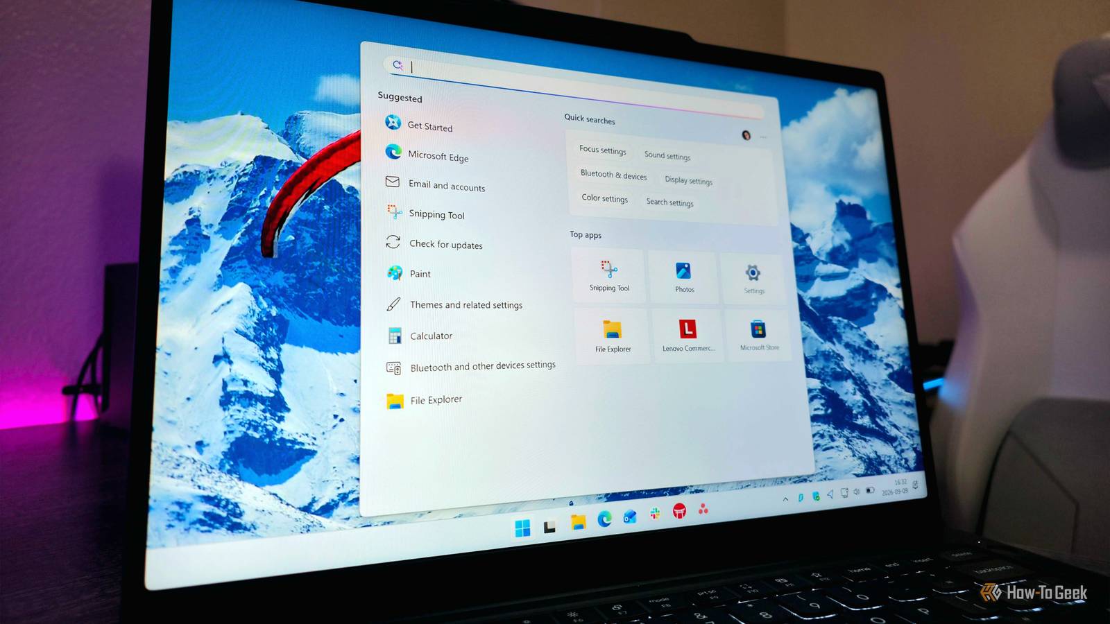 Image of a Lenovo laptop showing a simplified Taskbar and Windows Search menu.