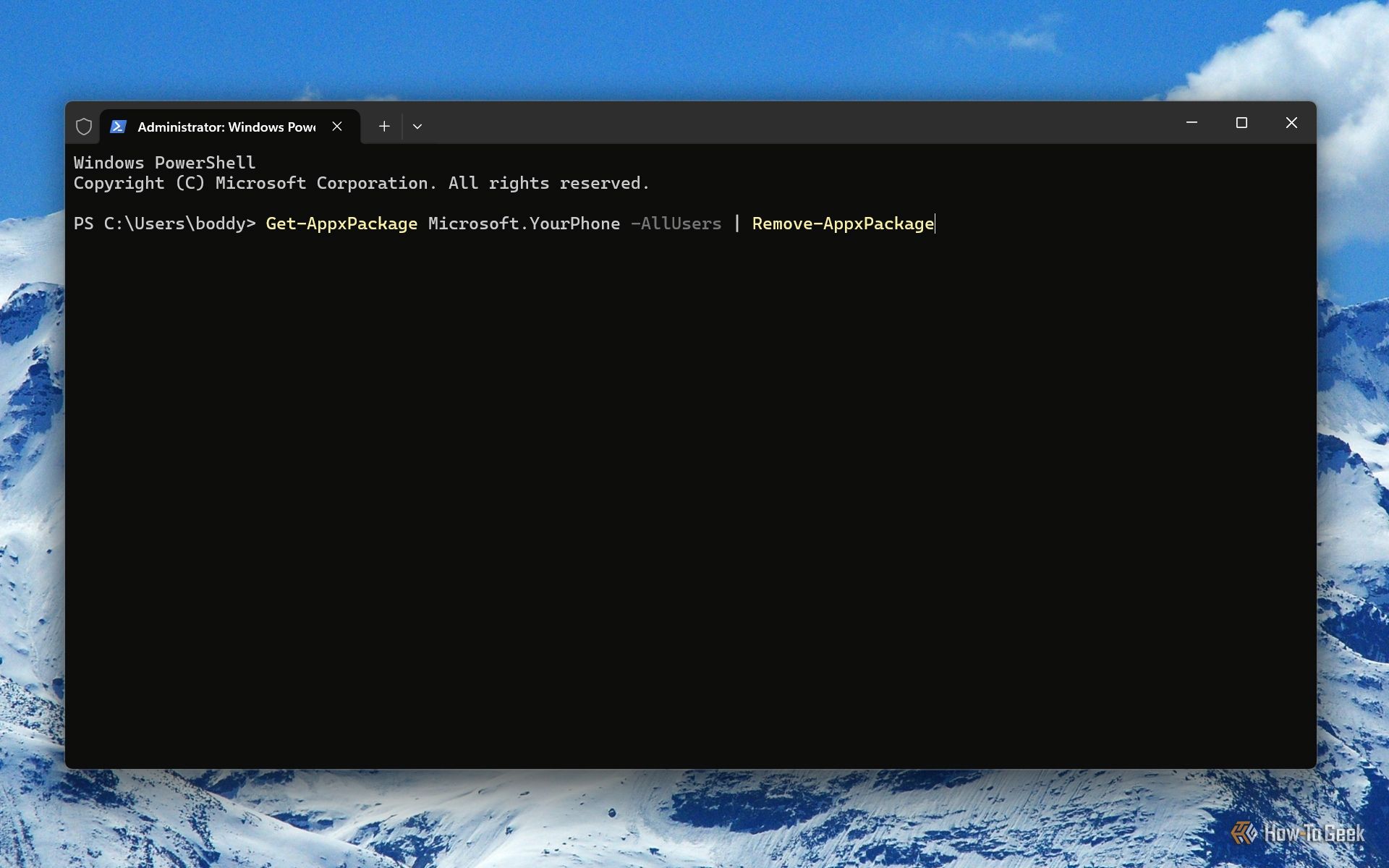 Screenshot of Windows 11's Terminal with the command to remove Phone Link.