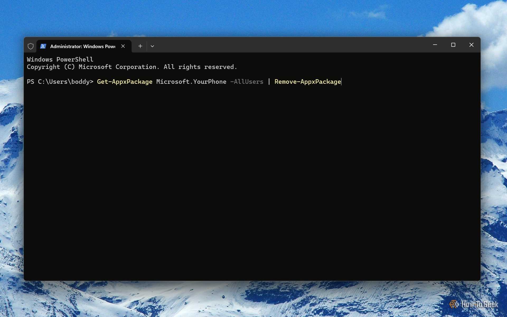 Screenshot of Windows 11's Terminal with the command to remove Phone Link.