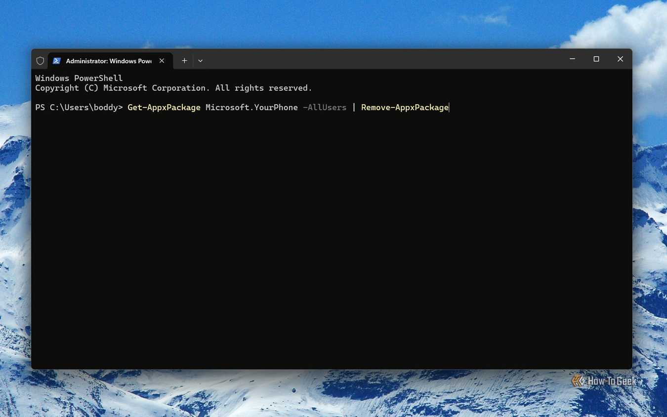 Screenshot of Windows 11's Terminal with the command to remove Phone Link.
