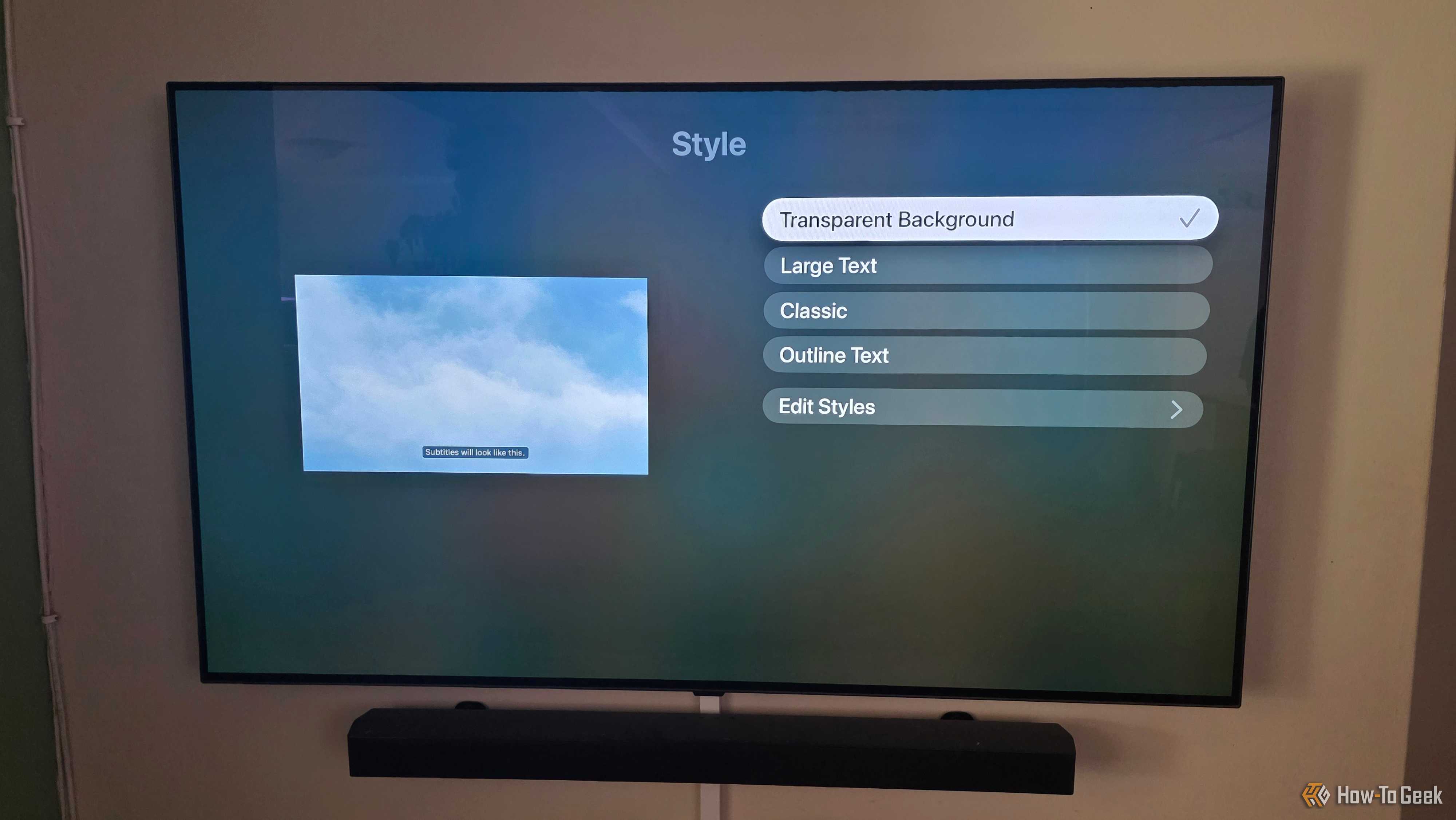 The Apple TV app is showing subtitle options to change styles with transparency selected.