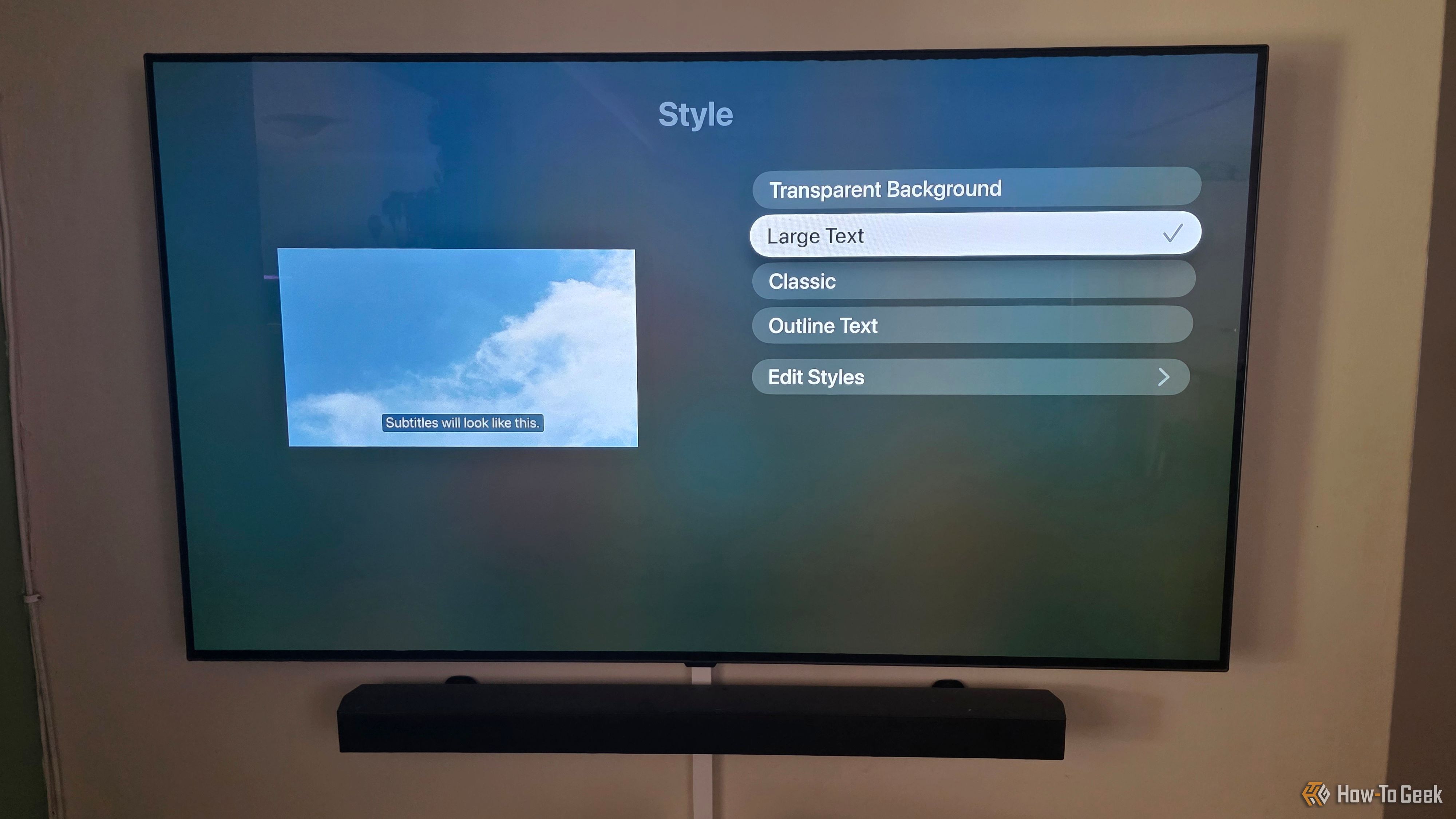 The Apple TV app is showing subtitle options to change styles with large text selected.