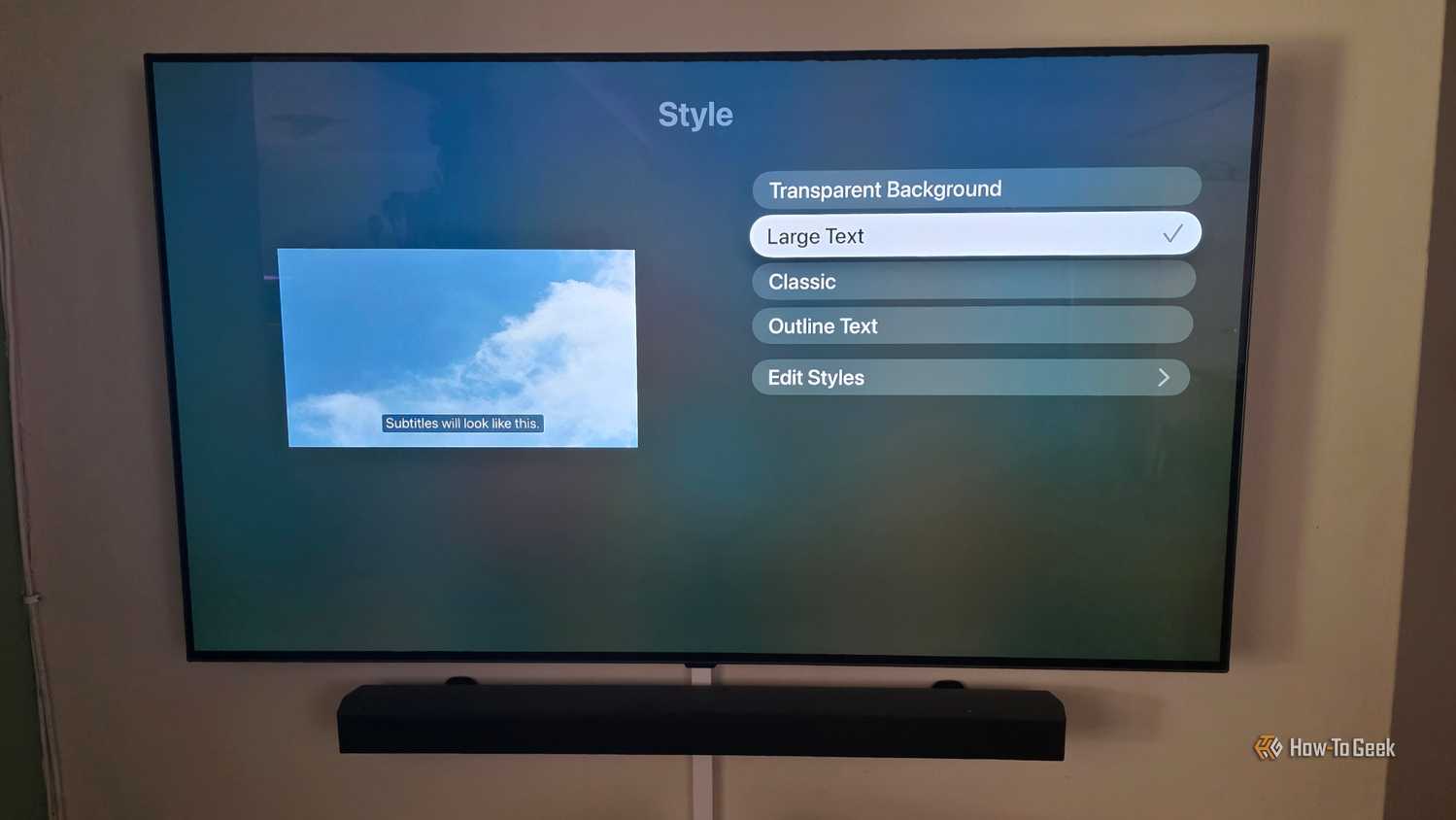 The Apple TV app is showing subtitle options to change styles with large text selected.