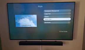 The Apple TV app is showing subtitle options to change styles with outlined text selected.
