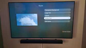 The Apple TV app is showing subtitle options to change styles with outlined text selected.