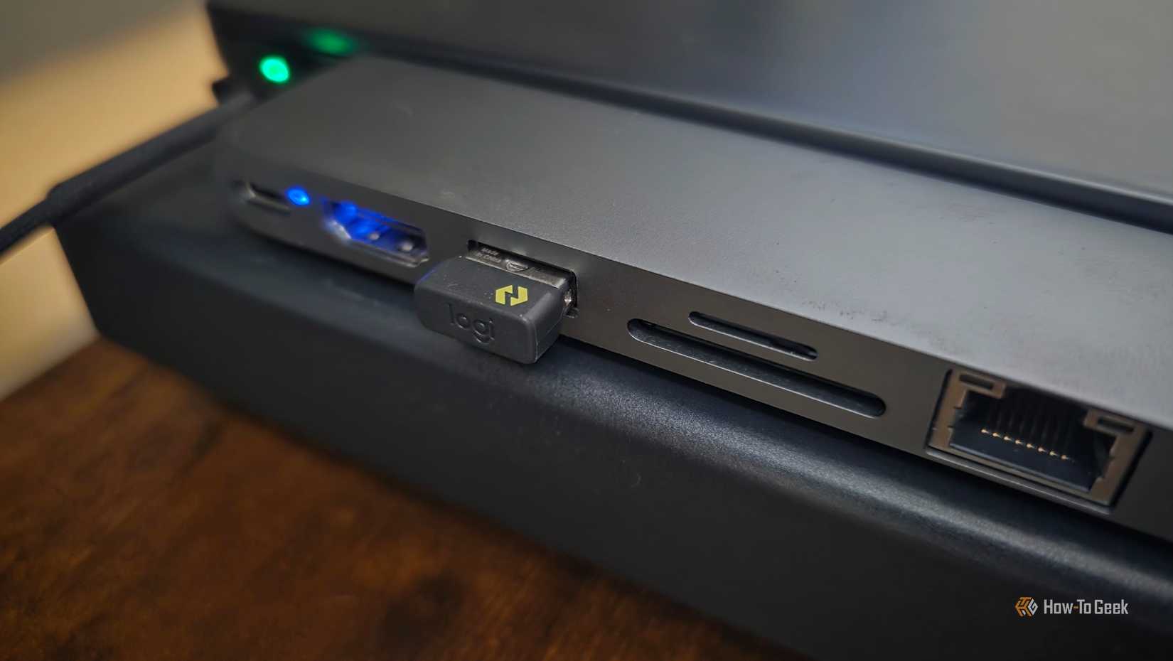 A Logi Bolt receiver is plugged into a USB docking station.
